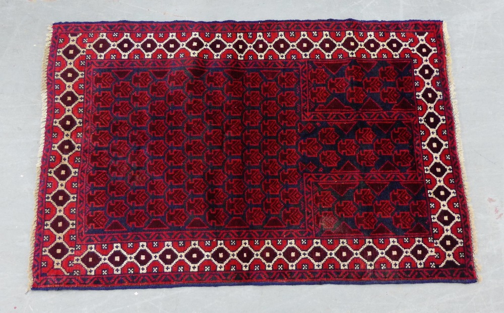 A Baluchi prayer rug with red field and overall foliate pattern, 138 x 88cm