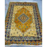 A silk rug the gold field with geometric motifs, 240 c 176cm