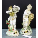 A pair of porcelain allegorical male and female figures (restored), each modelled standing upon a