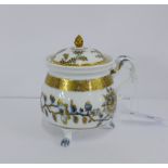 A Meissen porcelain 'Onion' patterned cream pot and cover, with ornate over gilding and acorn finial