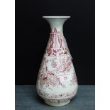 A Chinese flared rim vase with underglaze red floral and lappet leaf pattern, it has a Yangzhen