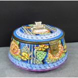 An Art Deco bowl painted in coloured enamels with cactus, it has a hinged lid with a stylised silver