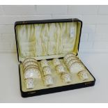 A Royal Worcester porcelain cabaret set in fitted case, painted with lilac floral sprays with gilt