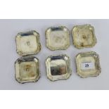 A set of six Reed & Barton American white metal dishes of square form with shell cast decoration,