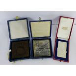 The Amateur Photographer medallion plaques to include a bronze example and two white metal (3)