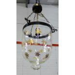 A glass and gilt patterned ceiling light with metal band to top, 34cm long