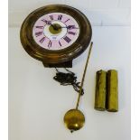 A Waggity Wa Wall clock, complete with weights and pendulum