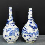 Two Chinese blue and white bottle neck Dragon vases, 25cm high, (2)