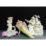 A Parian male and female figure group, together with a continental porcelain floral posy and a