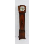 An oak cased Grandmother clock, the arched top over a silvered dial with Arabic numerals, 130 x 24cm