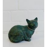 A green patinated bronze model of a cat, 15cm long