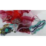 A quantity of turquoise and other coloured hardstone jewellery to include beads, necklaces and