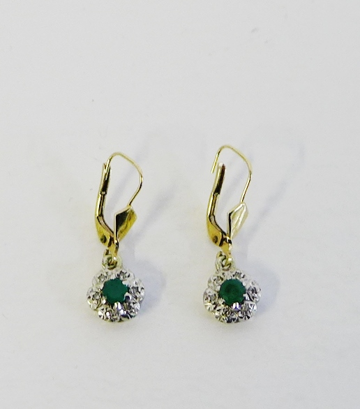 A pair of 9 carat gold earrings with emerald and diamond cluster drops