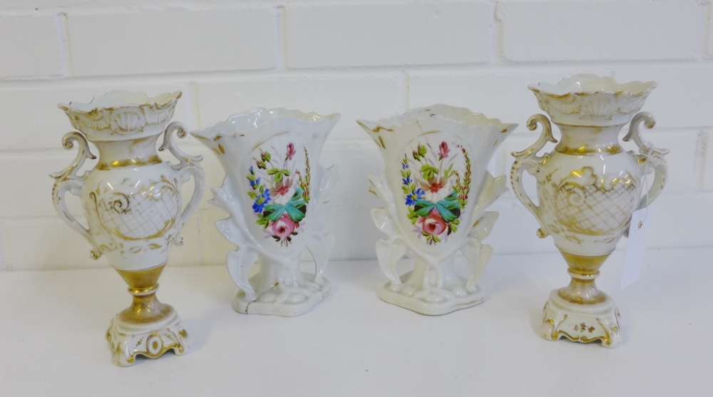 A pair of continental porcelain twin handlde and gilt decorated pedestal vases, together with a pair