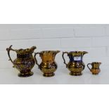 A group of four copper lustre jugs, tallest 19cm, (4)