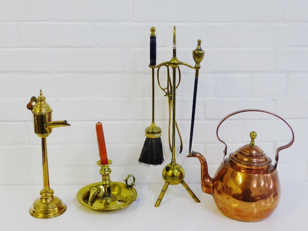 Copper and brass wares to include a kettle, watering can, Victorian chamber stick, brass trivet