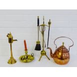 Copper and brass wares to include a kettle, watering can, Victorian chamber stick, brass trivet