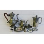 A collection of pewter to include a coffee pot, candle chamber stick, measures, jugs, pewter