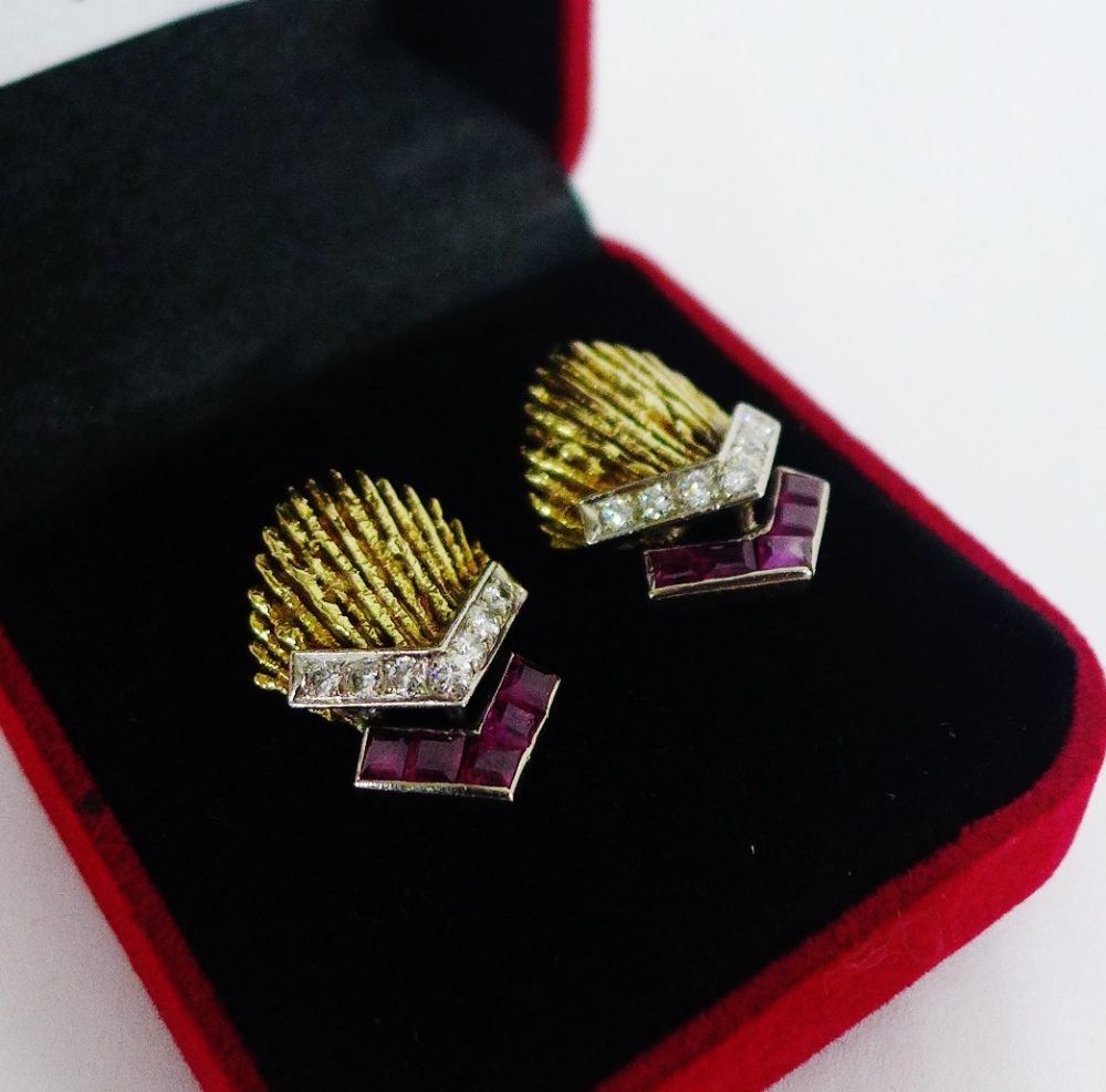 A pair of unmarked gold earrings, circa 1970's, each with a textured fantail panel in the style of