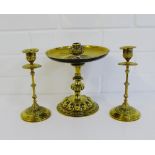 A pair of ornate brass candlesticks, together with another with circular drip tray, tallest 20cm, (