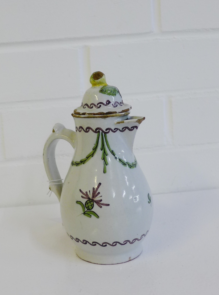 18th century Continental tin glazed hot water / coffee pot and cover with fruit pattern in