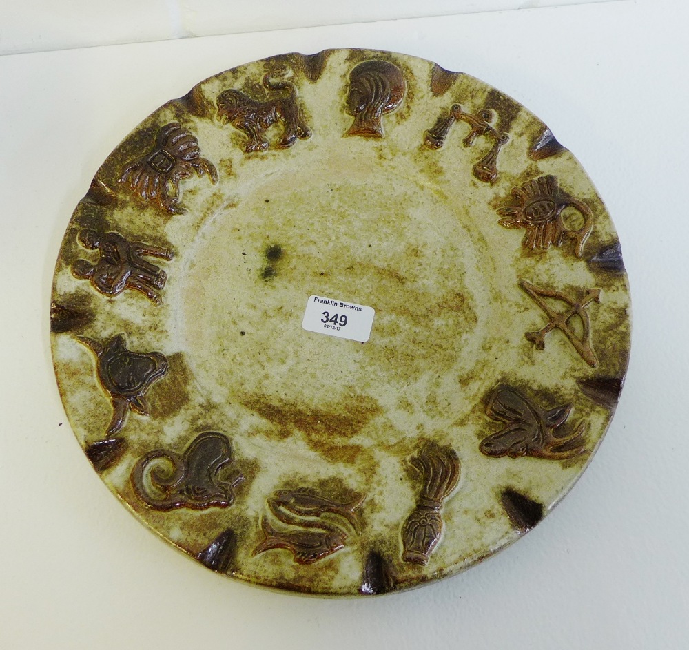 A stoneware circular Zodiac plaque, 32cm diameter