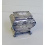 An Epns tea caddy with hinged lid and bun feet, 12cm high