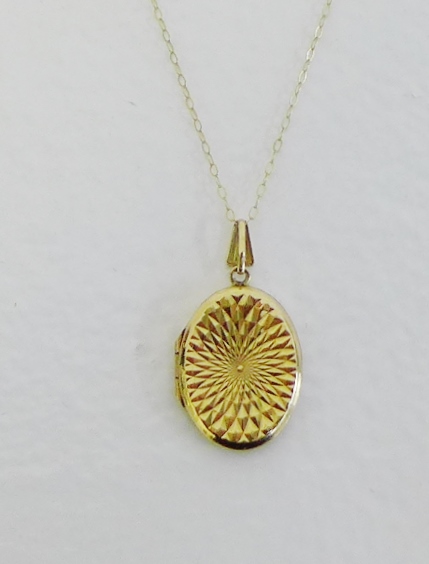9 carat gold engraved oval locket on 9 carat gold chain