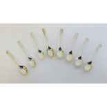 George V silver rat tail bowl teaspoons to include seven with makers mark for Walker & Hall,