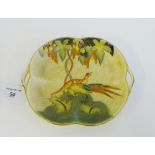 A Crown Devon 'Fieldings' Art Deco twin handled dish, hand painted with Peacock and Tree pattern,