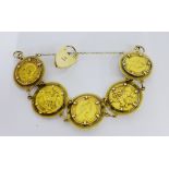 A 9 carat gold bracelet with five engraved circular panels each containing a full gold sovereign