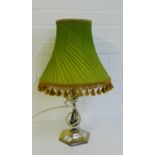 A silver plated octagonal stemmed table lamp and shade