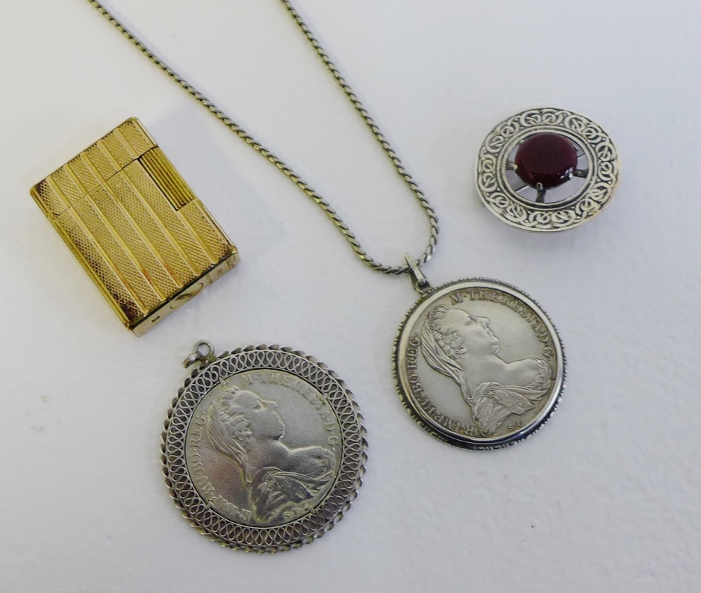 A mixed lot to include DuPont gold plated lighter, two Maria Theresia Thaler coin pendants and a