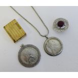 A mixed lot to include DuPont gold plated lighter, two Maria Theresia Thaler coin pendants and a