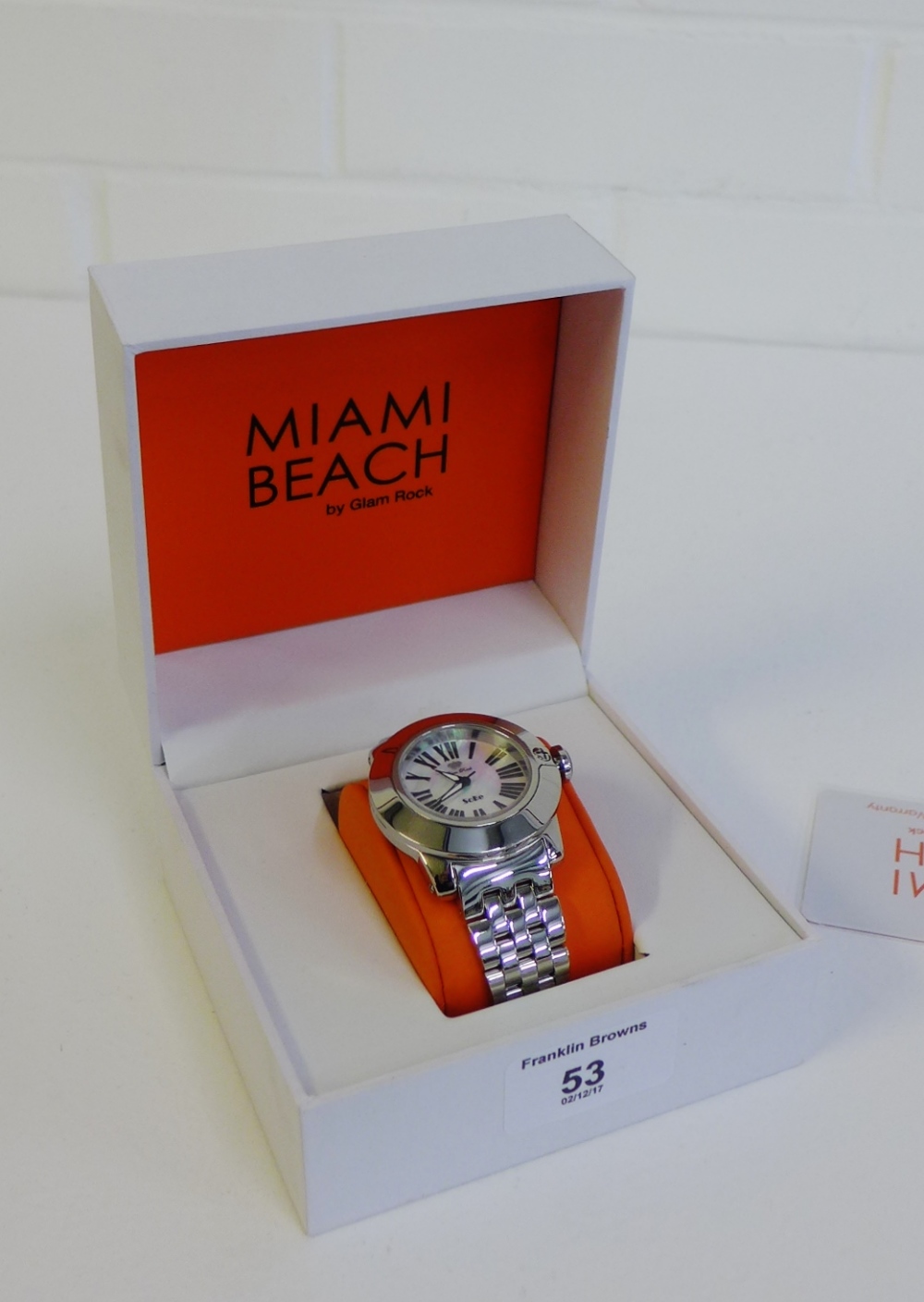Lady's Glam Rock Miami Beach wristwatch, the mother of pearl dial with Roman numerals on a stainless