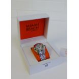 Lady's Glam Rock Miami Beach wristwatch, the mother of pearl dial with Roman numerals on a stainless