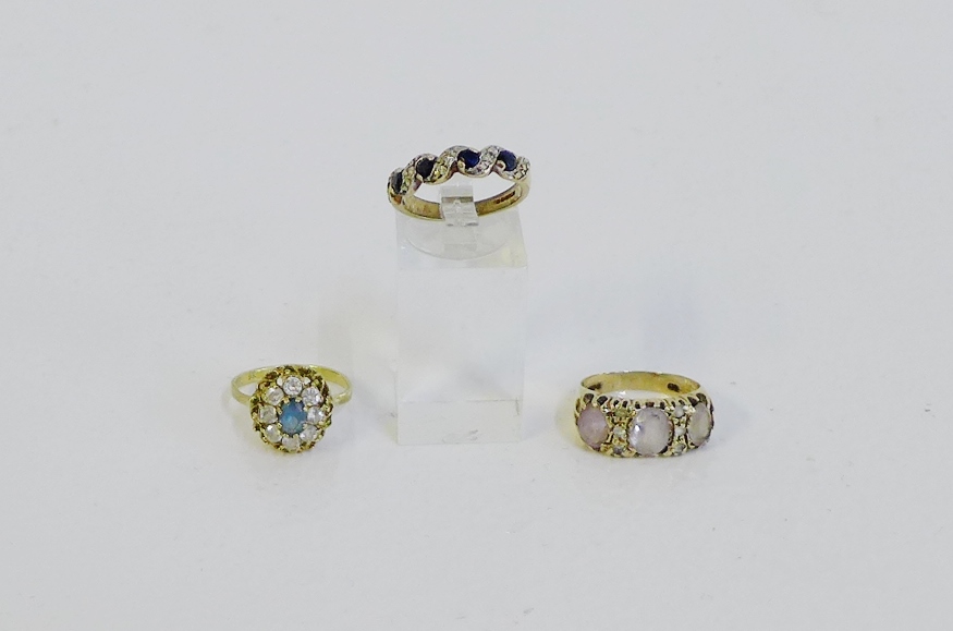 Three 9 carat gold gemset rings to include a diamond and sapphire eternity ring (3)