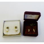Four pairs of earrings to include 9 carat gold gemset earring and half hoop examples together with
