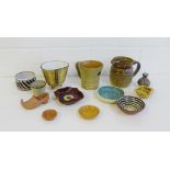 A collection of small Studio Pottery items to include an Ambleside three footed vase, (13)