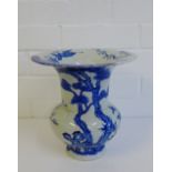 A Chinese flared rim blue and whit vase painted with cranes, birds and prunus pattern on a