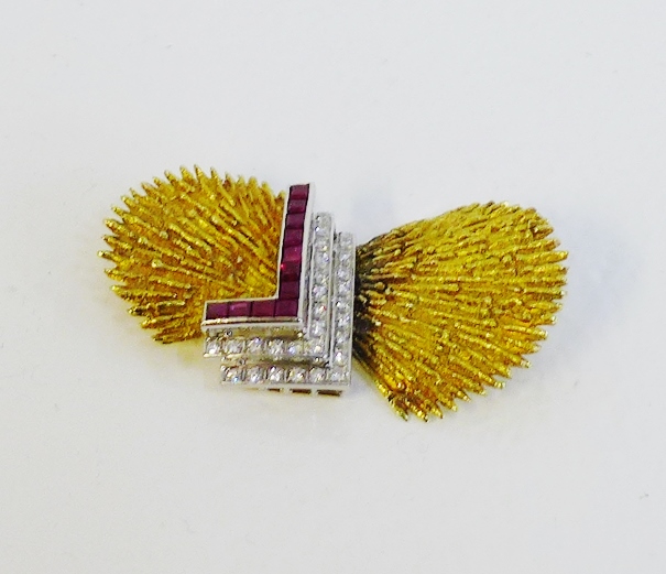 A vintage 14 carat gold brooch, circa 1970's, with two textured yellow gold panels in the style of