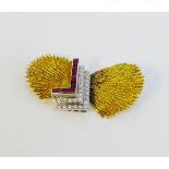 A vintage 14 carat gold brooch, circa 1970's, with two textured yellow gold panels in the style of