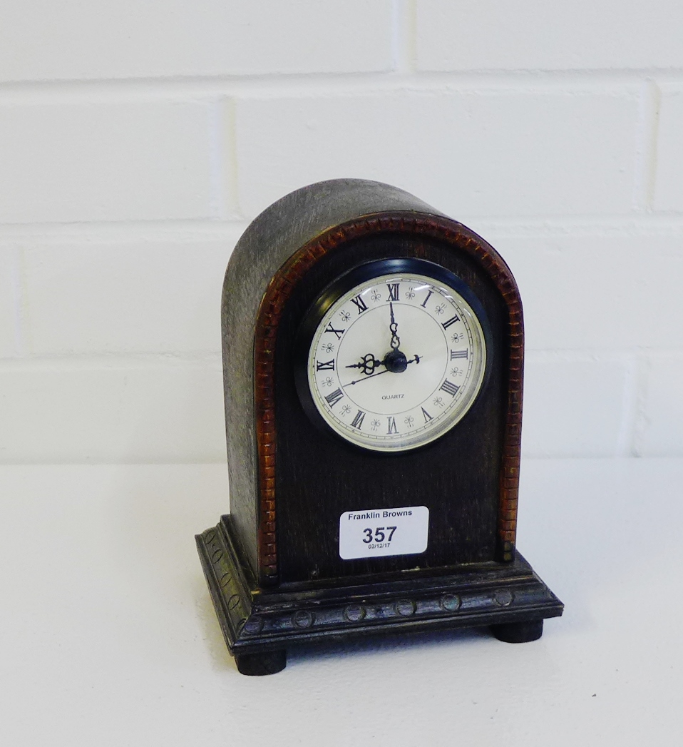 An oak cased mantle clock