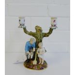 A 19th century Meissen candelabra (with losses), blue cross swords mark to base, 22cm high