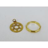 A 9 carat gold wedding band and an unmarked gold Star of David pendant (2)