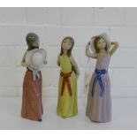 A group of three Lladro porcelain female figurines, tallest 25cm, (3)