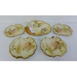 A set of six GD & C, Limoges, blush ivory plates with gilt edged rims and hand painted floral