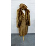 A mink coat with double breasted front, together with a mink hat and a tippet, (3)