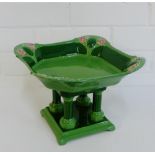 An Eichwald green glazed Art Nouveau comport of square form on quadruple column base, 18.5cm high