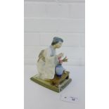 A Lladro porcelain figure of a Japanese girl modelled kneeling with a vase of flowers, 19cm high